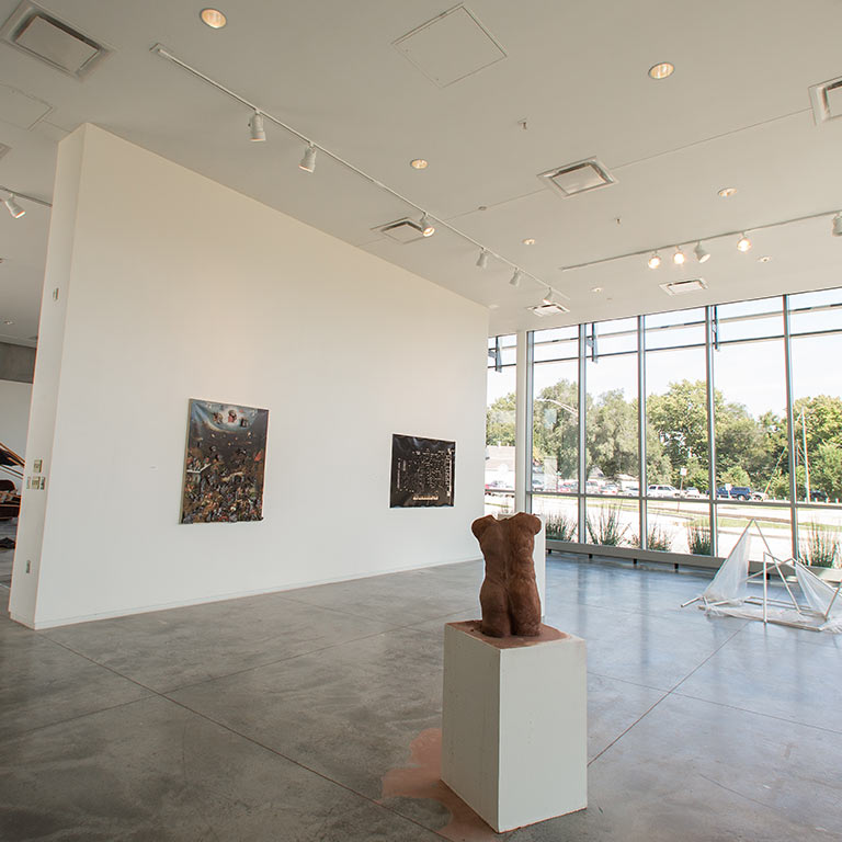 Inside of a large, naturally lit gallery space.